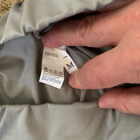 Silver Skorts. Slits on sides. Size Medium. 100% Polyester. Made in China. - Picture 3 of 3